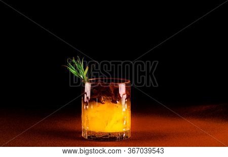 Quarantini Or Homemade Alcohol Drink In A Glass Beaker On Terracotta Background. The Concept Of New 