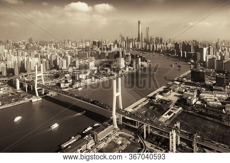 Shanghai Nanpu Bridge over Huangpu River with busy traffic in China.