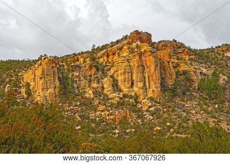 Sandstone Cliffs Rising Out Of The Desert In The La Ventana Area Of El Malpais National Monument In 