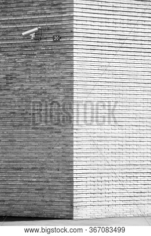 Cctv Camera On A Brick Wall In Switzerland