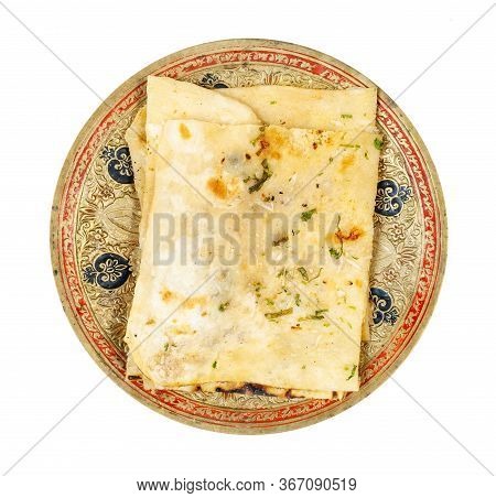 Indian Cuisine - Top View Of Garlic Naan (garlicky Flatbread) On Brass Plate Isolated On White Backg