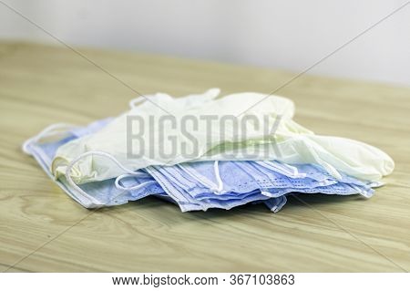 Protective Hygiene Masks And Gloves Are On Atable