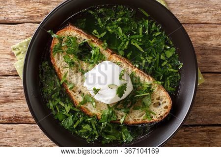 Light Portuguese Green Soup Acorda With Poached Bread And Egg Close-up In A Plate. Horizontal Top Vi