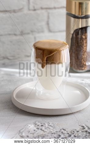 Creamy Whipped Dalgona Coffee On White Concrete Background.