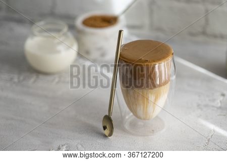 Creamy Whipped Dalgona Coffee On White Concrete Background.