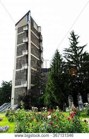 Baia Mare, Romania - June 17, 2019: The Baia Mare Old People's Monument And Part Of The Prefecture B