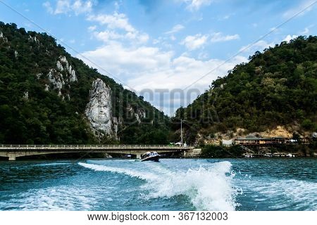 Cazanele Dunarii, Romania - September 08, 2019: Decebal Statue, Decebal Bridge, Boat Walks And Danub