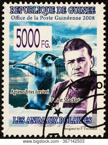 Moscow, Russia - May 20, 2020: Stamp Printed In Guinea Shows Portrait Of Irish Antarctic Explorer Er