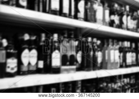 Blurry Background Texture, Different Kinds Of Alcohol On The Shelves In The Store, Lots Of Flavoured