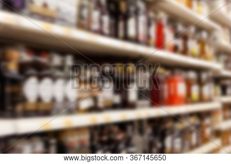 Blurry Background Texture, Different Kinds Of Alcohol On The Shelves In The Store, Lots Of Flavoured