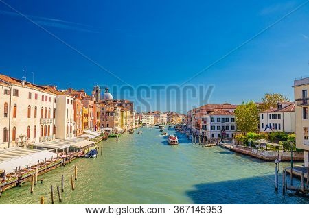 Venice Cityscape With Grand Canal Waterway. View From Scalzi Bridge. Gondolas, Boats, Yachts, Vapore