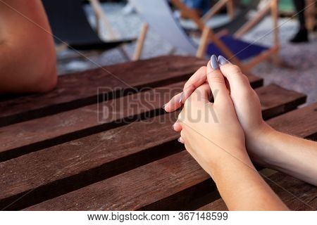 Young Woman Hands With Light Blue Painted Nails, Folded Hands Nervous Gesture, Hands Together On The