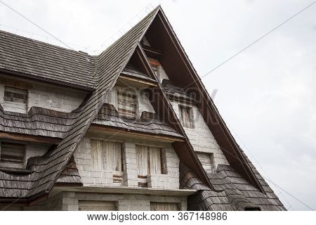 A Small Mountain Wooden House / Cottage Front Under Construction. Traditional Wooden Roof Shingle. R