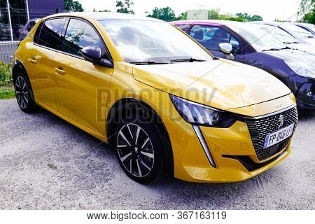 Bordeaux , Aquitaine / France - 05 14 2020 : Peugeot 208 E-208 Golden Yellow New Model Car Parked In