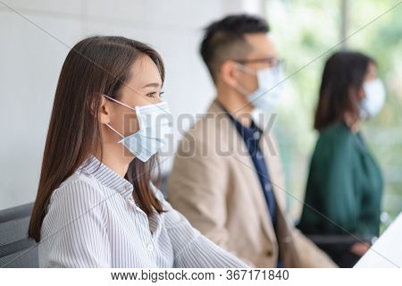 Business Employees Wearing Mask During Work In Office To Keep Hygiene Follow Company Policy.preventi