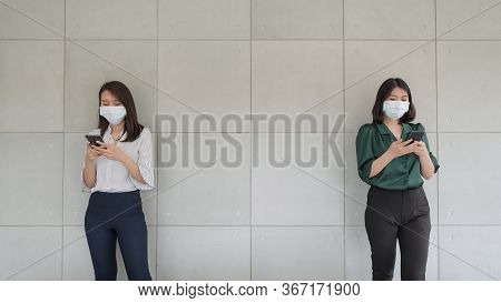 Business Employees Wearing Mask During Work In Office To Keep Hygiene Follow Company Policy.preventi