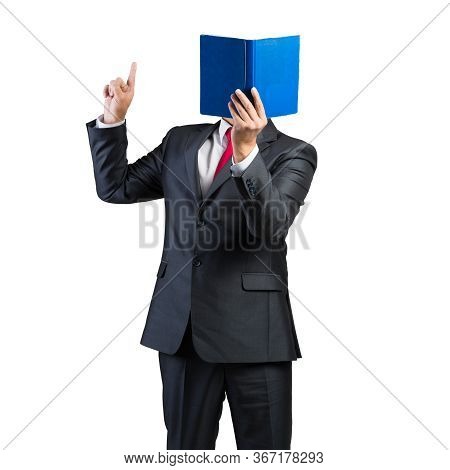 Businessman Covered His Face With Book And Finger Pointing Up. Portrait Of Man In Business Suit And 