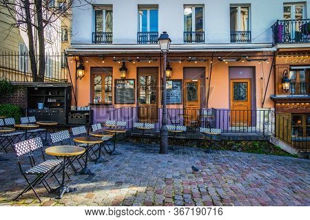 Paris, France, Feb 2020, view of the terrace of “Le Relais de la Butte” restaurant in the heart of Montmartre