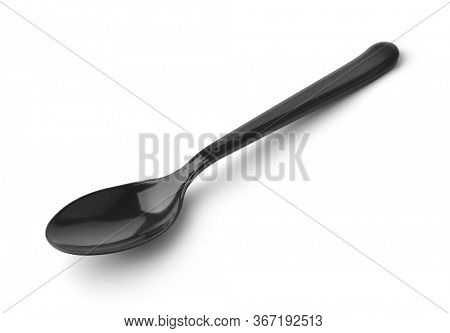Disposable black plastic spoon isolated on white