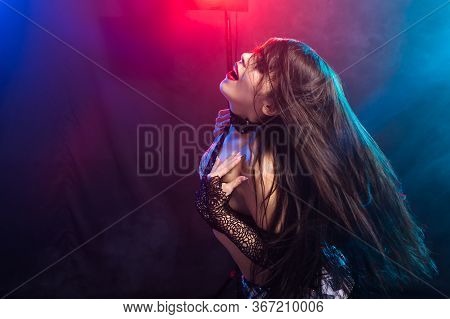 Girl Dancing Belly Dance, Fusion Or Tribal. A Woman In A Beautiful Costume Demonstrates Charming And