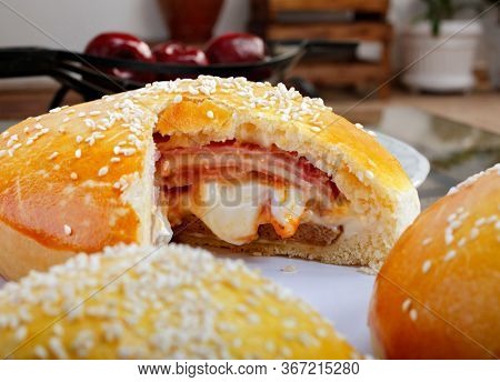 Brazilian snack, wrapped in ham and mozzarella, 