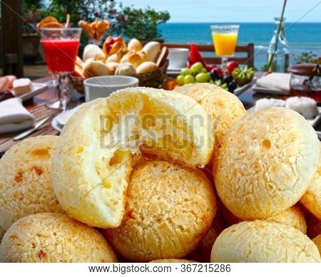 Brazilian snack, traditional cheese bread from Minas Gerais - pao de queijo, breakfast by the sea