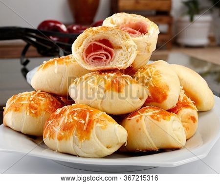 Brazilian snack, wrapped in ham and mozzarella, 