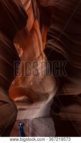 Antelope Canyon Tourist In Mask Taking Photo In The Canyon