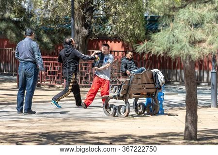 Beijing / China - April 3, 2016: People Practicing Kung Fu In Ritan Park In Beijing, China