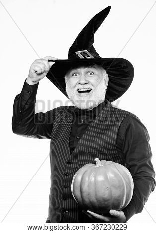 Halloween Traditions. Evil Wizard Hold Orange Pumpkin. Bearded Man Ready For Halloween Party. Starga