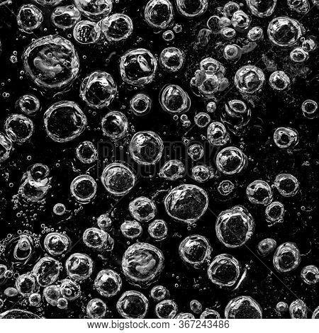 Beautiful Close-up on air bubbles stuck in frozen water