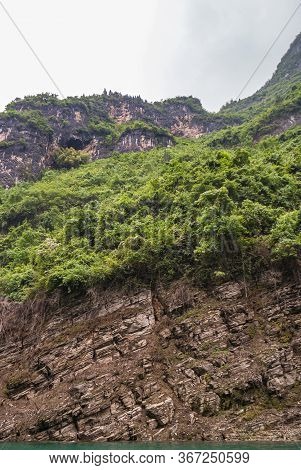 Wushan, Chongqing, China - May 7, 2010: Mini Three Gorges On Daning River. Black Cave High Up In Bro