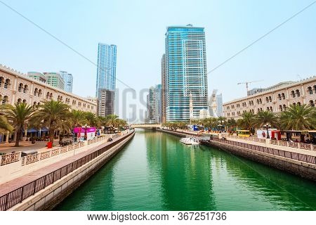 Sharjah, Uae - March 01, 2019: Al Qasba Canal Promenade In The Sharjah City Centre In United Arab Em