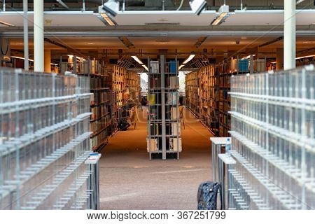 February 18, 2019. Warsaw, Poland. University Library. Bookshelf In Library With Many Books. Interio
