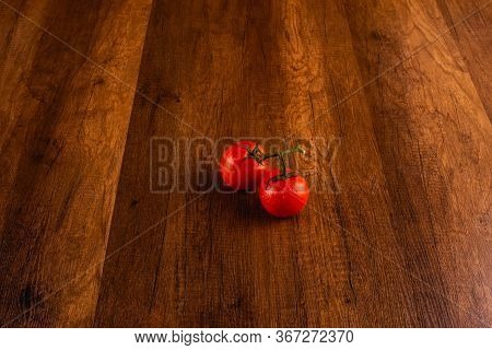 Tomotoes On The Wooden Background Ta Home.