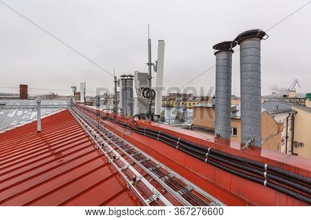 Panel Antennas Of 5g Band, Optical Fibers, Power Cables And Outdoor Remote Radio Units Are As Part O