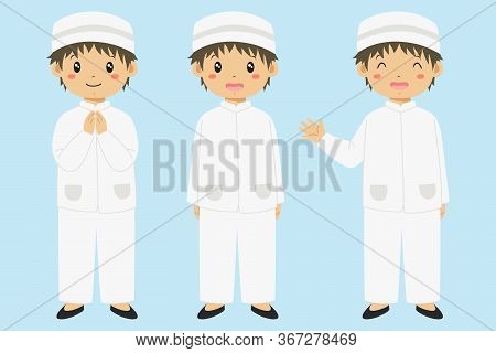 Happy Muslim Boy In White Koko Shirt And Kopiah Hat, Smiling And Waving Hand, Isolated In Blue Backg