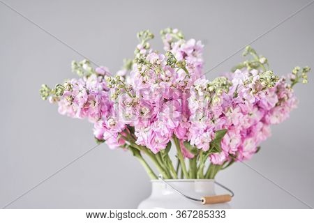 Bouquet Of Beautiful Lilac Mattiola. Spring Flowers In Vase On Wooden Table. Flowers Delivery.