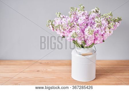 Bouquet Of Beautiful Lilac Mattiola. Spring Flowers In Vase On Wooden Table. Flowers Delivery.
