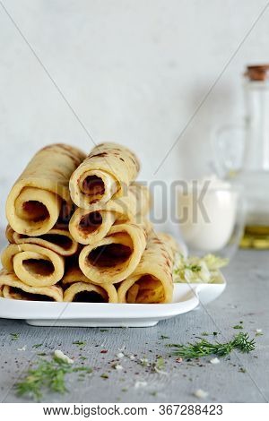 Norwegian Potato Pancakes Lefse On A Light Background With Cheese And Greens. Traditional Scandinavi
