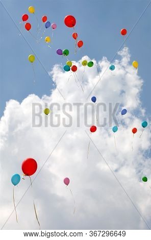 Blue Sky And White Clouds With Large Colorful Balloons Inflated With Helium Gas To Cheer Up The Part