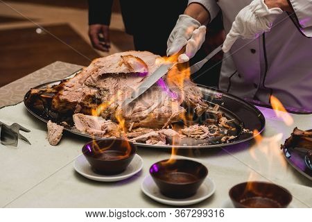 Appetizing Grilled Meat On Fire Close-up. Beautiful Presentation Of The Dishes In The Restaurant