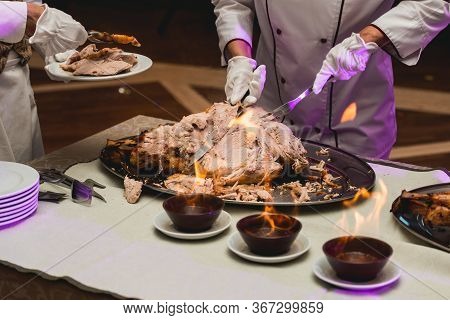 Appetizing Grilled Meat On Fire Close-up. Beautiful Presentation Of The Dishes In The Restaurant