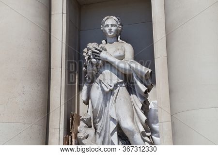Barcelona, Spain - May 16, 2017: Sculpture With Woman In The Facade Of Iberostar Hotel Building On T
