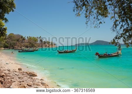 Exotic Islands. Boats Stand In Azure Water Near The Shore. Phuket, Thailand