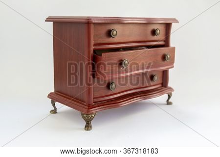 Wooden Chest Of Drawers On A White Background