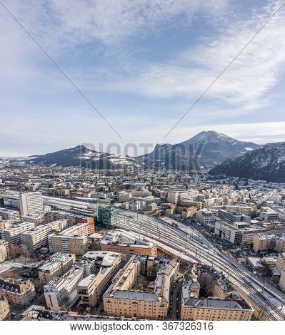 Aerial Drone Shot View Of Railway Statioin In Salzburg Covered With Snow In Winter Morning