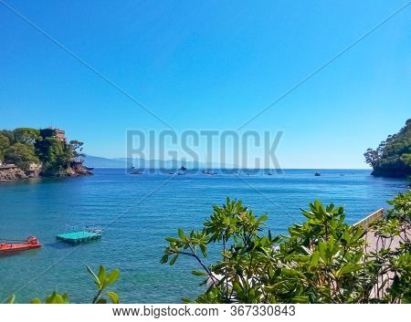The Beach Known As Paraggi Near Portofino In Genoa On A Blue Sky And Sea Background