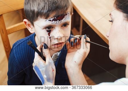 Little Cute Child Making Facepaint On Birthday Party, Zombie Apocalypse Facepainting, Halloween Prep