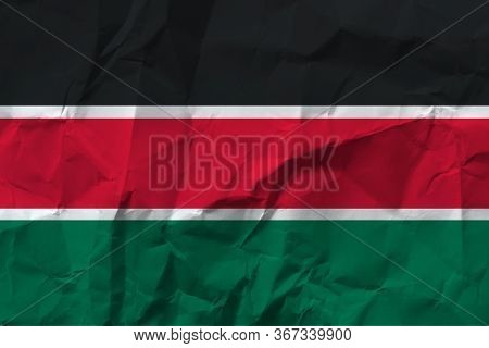 National Flag Of Kenya Black, Red And Green On Crumpled Paper.